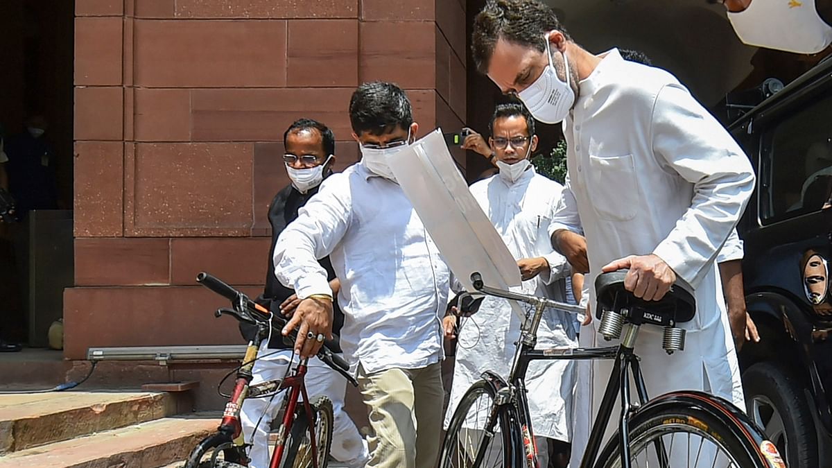 Rahul Gandhi clicked with a bicycle during a symbolic protest over fuel price hike. Credit: PTI Photo