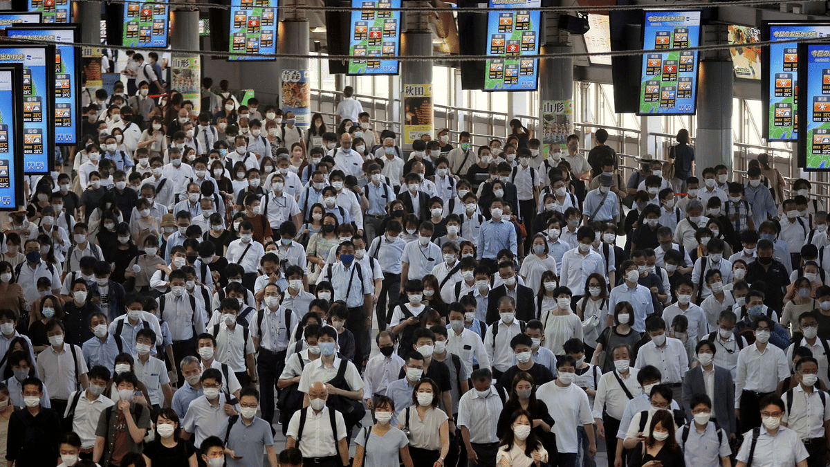 Commuters wearing face masks arrive at Shinagawa Station at the start of the working day amid the coronavirus disease outbreak, in Tokyo, Japan. Credit: Reuters Photo