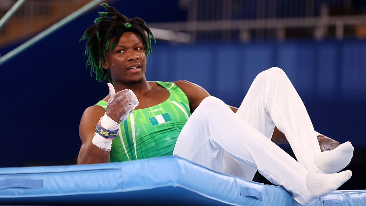 Nigerian gymnast Uche Eke's highlights are more subtle — he has green ends to match his uniform. Credit: Reuters Photo