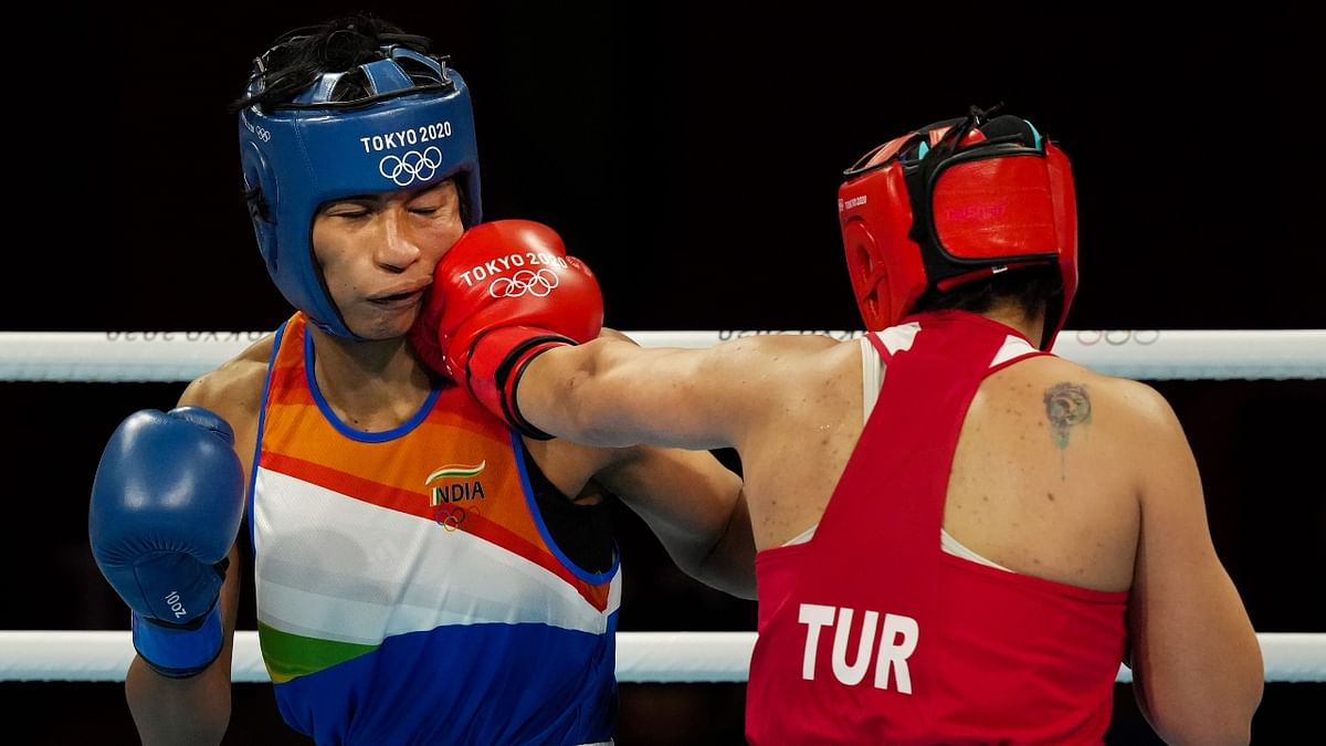Lovlina Borgohain exchanges punches with Busenaz Surmeneli of Turkey in the women's welterweight (64-69kg) category boxing semifinal match. Credit: PTI Photo