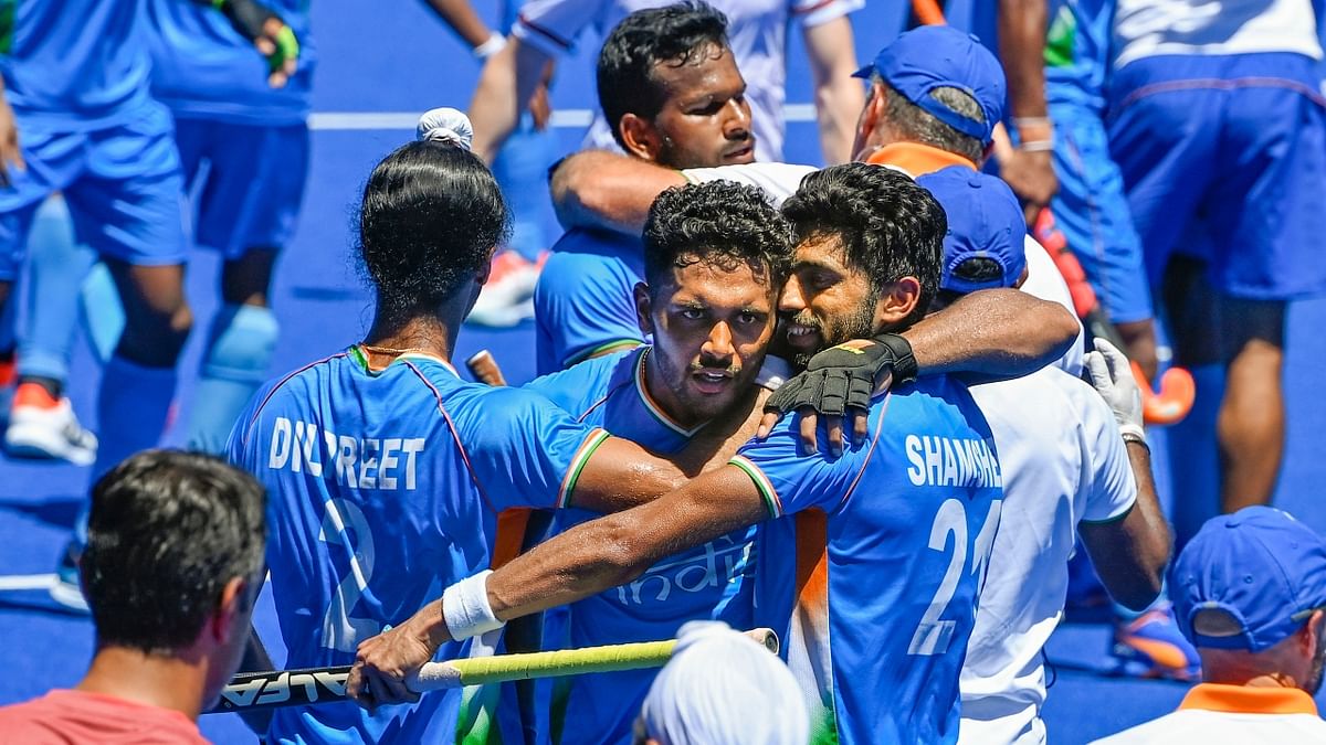 Indian players celebrate their victory over Germany in the men's field hockey bronze medal match. Credit: PTI Photo