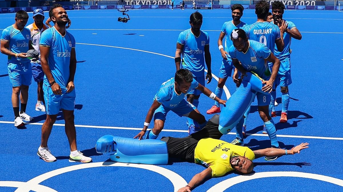 Indian players celebrate their victory over Germany in the men's field hockey bronze medal match. Credit: Reuters Photo