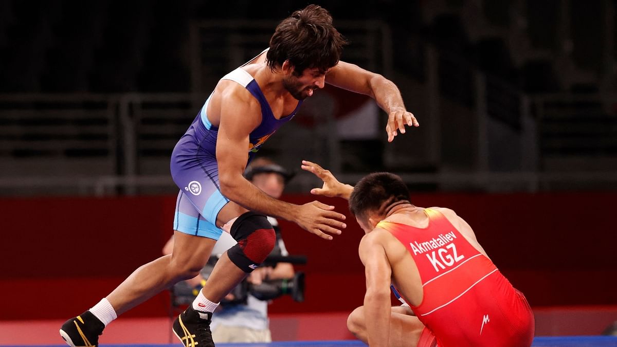 True to his style, Bajrang Punia put his tactical acumen and strength to good use in the second period to pin Iran's Morteza Cheka Ghiasi for a semifinal berth in the men's free-style 65kg event which took him closer to an Olympic medal at Tokyo Olympics. Credit: AFP Photo