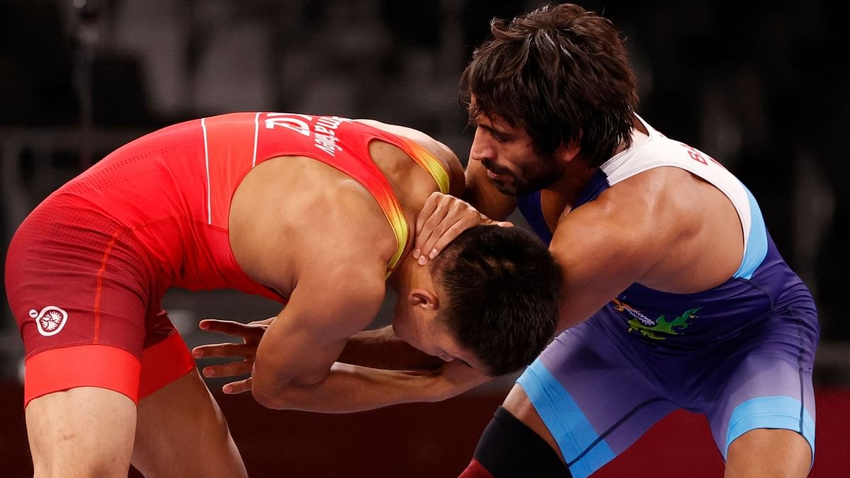 But Bajrang not only wriggled out of that clutch, he locked the neck of Ghiasi and moved into a position from where he turned his rival, pushed him on the mat and held him with his immense strength to emerge victorious by fall. Credit: AP Photo