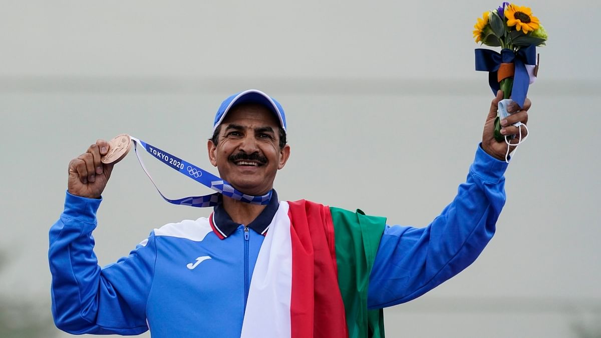 Kuwait's Abdullah Alrashidi celebrates his win at the men's skeet at the Asaka Shooting Range in the 2020 Summer Olympics. Credit: AP Photo