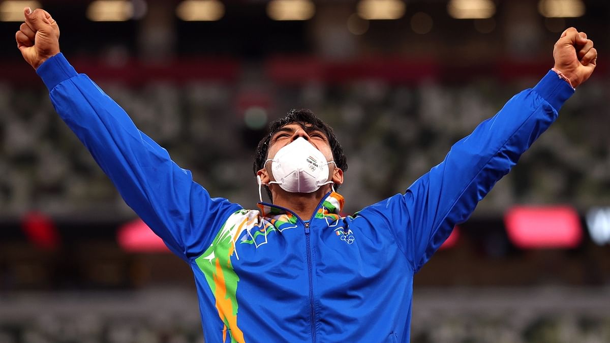 India's golden boy Neeraj Chopra celebrates on the podium. Credit: Reuters Photo