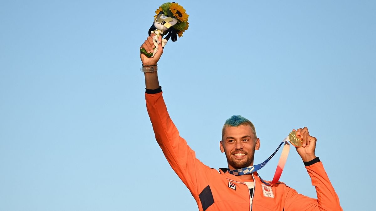 Kiran Badloe of the Netherlands celebrates winning the gold medal in the men's windsurfing RS:X medal race. Credit: AFP Photo