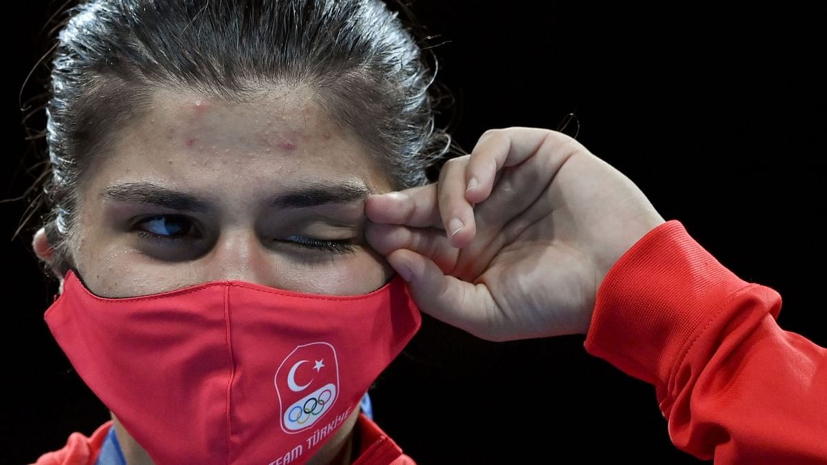 Gold medallist Busenaz Surmeneli of Turkey gets emotional on the podium during the medal ceremony. Credit: Reuters Photo