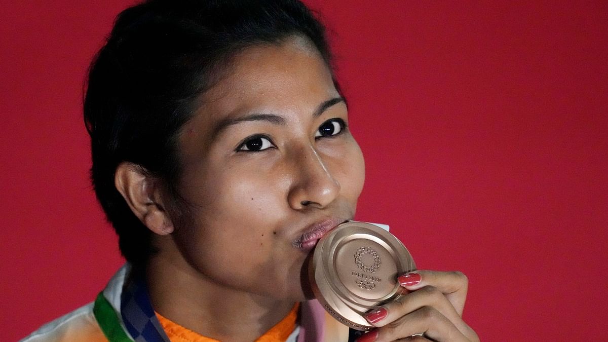 India's Lovlina Borgohain kisses her medal after the ceremony. Credit: Reuters Photo