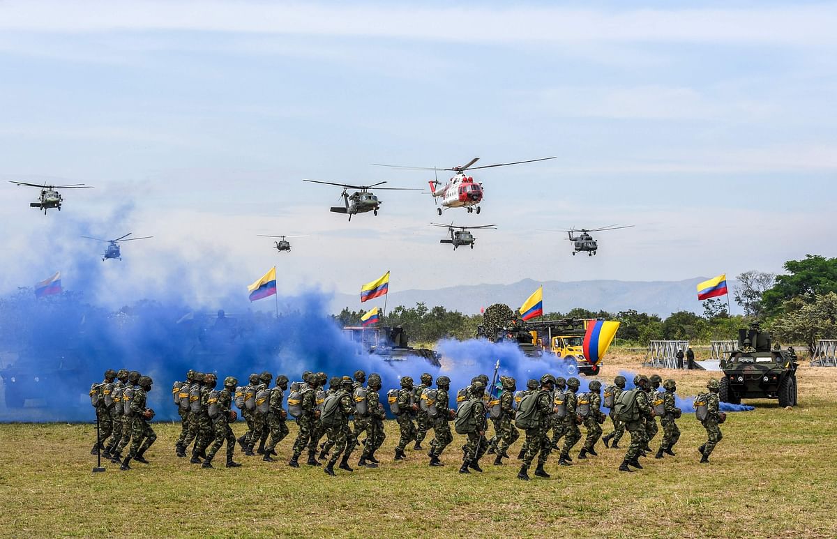 Members of Colombian army take part in a military parade in commemoration of the Colombian Army day in Tolemaida southeast of Bogota. Credit: AFP Photo