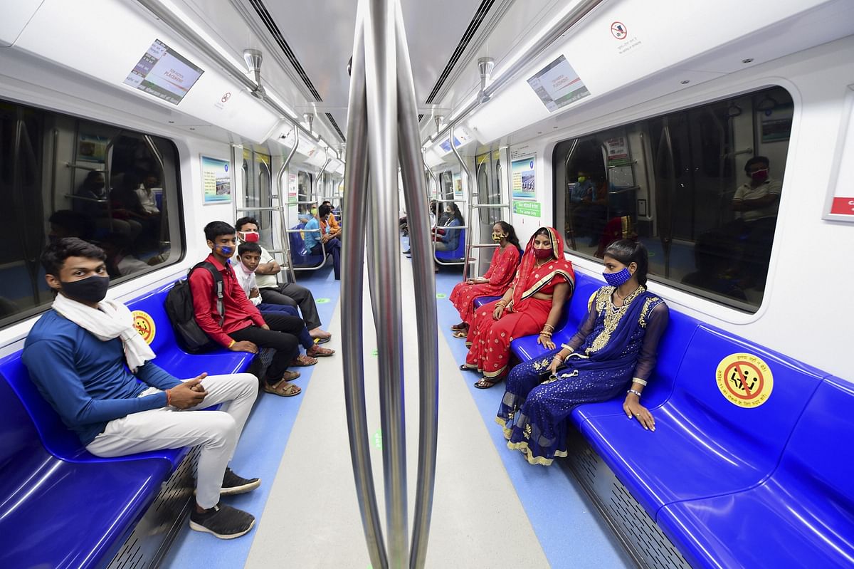 Commuters travel in a metro train after Delhi Metro's remaining portion of the Pink Line corridor was inaugurated, in New Delhi. Credit: PTI Photo