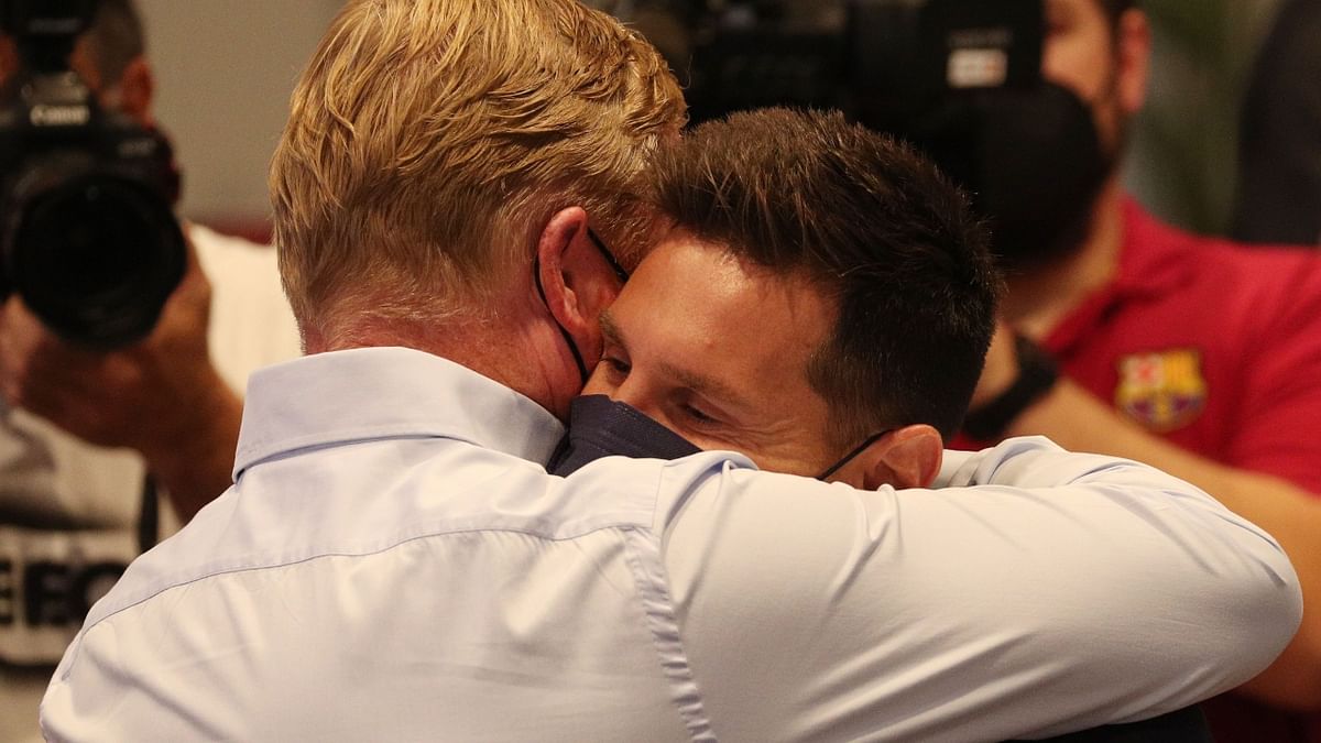 Lionel Messi shares a warm hug with coach Ronald Koeman after the press conference. Credit: Reuters Photo
