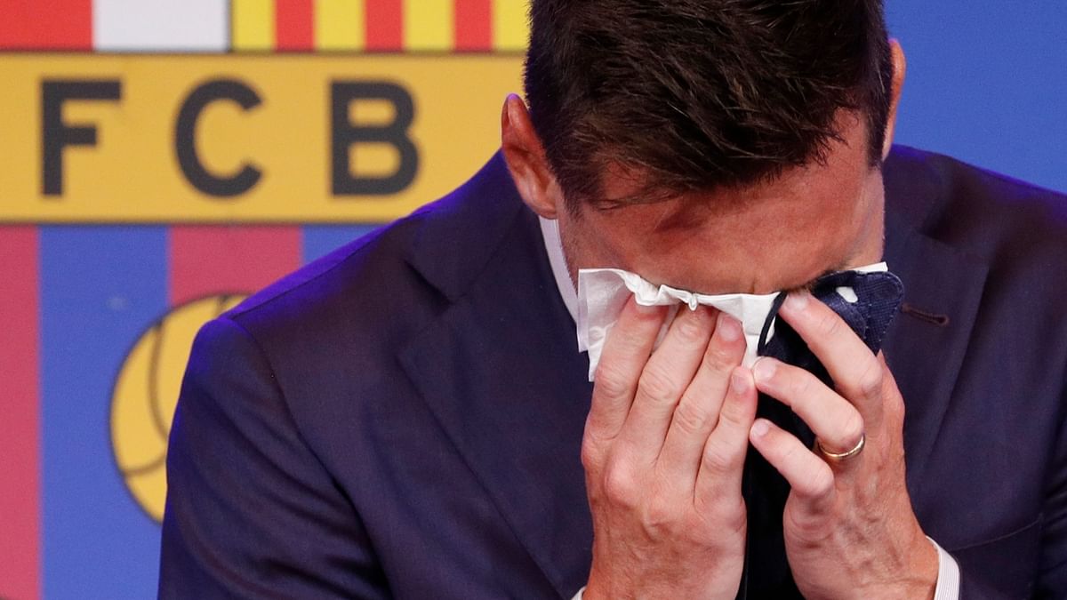 An emotional Messi is seen wiping his tears during the press conference. Credit: Reuters Photo