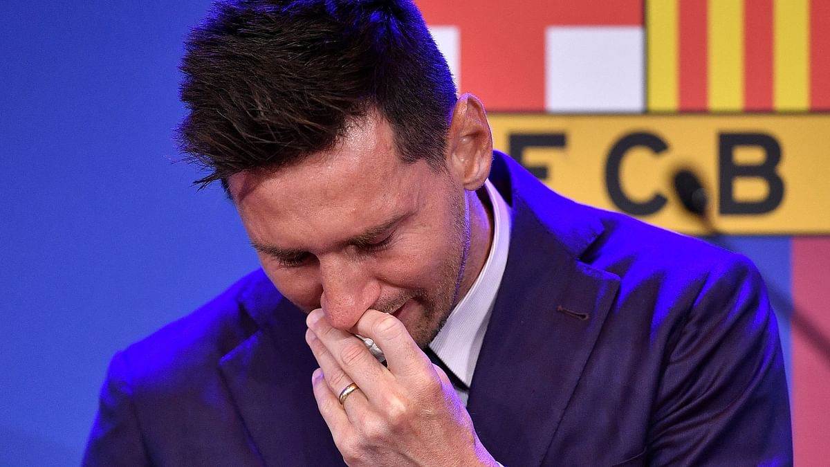 Messi was seen wiping his tears several times before a squadron of reporters at the club's Camp Nou ground who gave him a standing ovation. Credit: AFP Photo