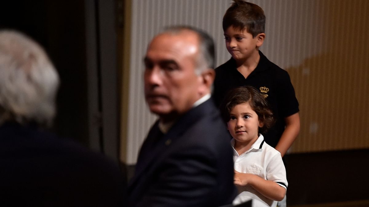 Messi's children Thiago and Ciro get clicked during the press conference. Credit: AFP Photo