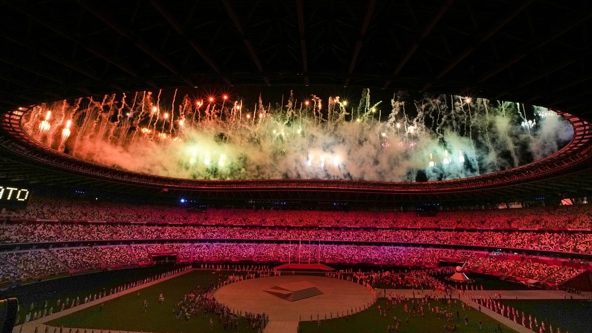 Fireworks illuminate the Olympics Stadium as it displays 'Arigato' during the closing ceremony of the Summer Olympics 2020, in Tokyo. Credit: PTI Photo