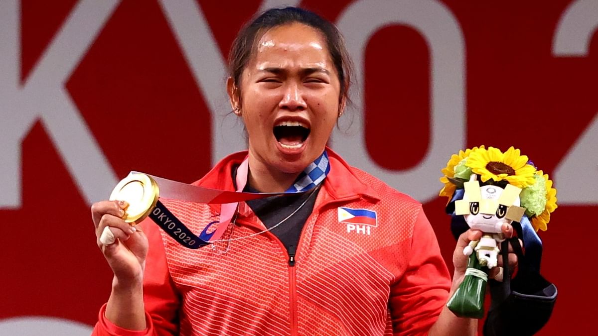 Philippine weightlifter Hidilyn Diaz, who scripted history by bagging country's first gold at the Tokyo Olympics, will be receiving a luxury apartment, a new vehicle along with free petrol, and free commercial flights for life. Credit: Reuters Photo