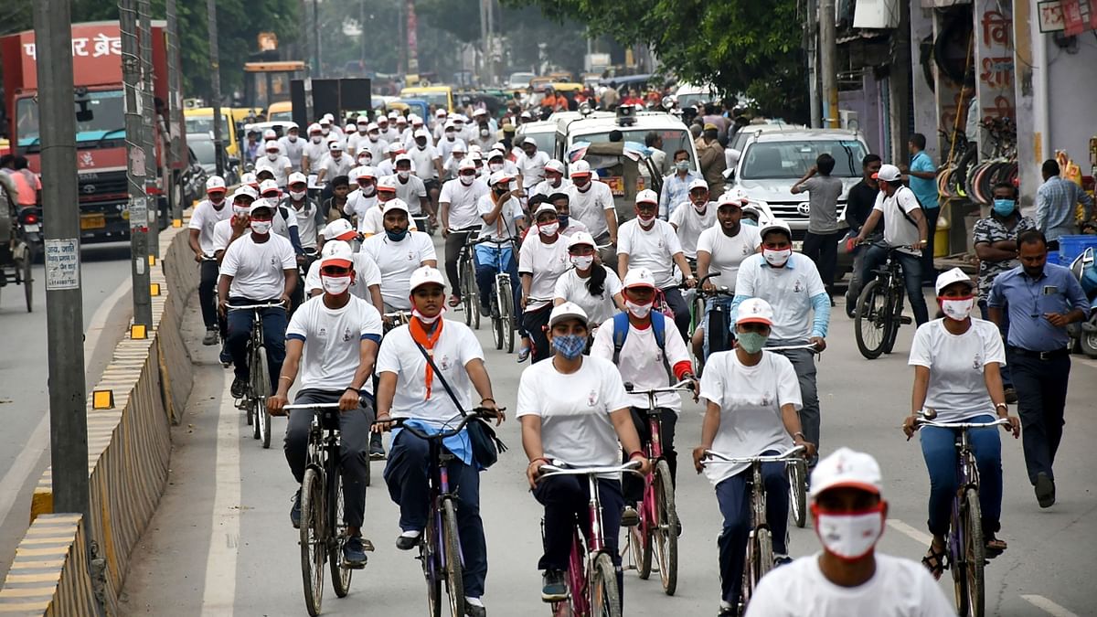 Youth participate in a bicycle rally organised as part of Amrit Mahotsav, commemorating 75th Independence Day, in Varanasi. Credit: PTI Photo