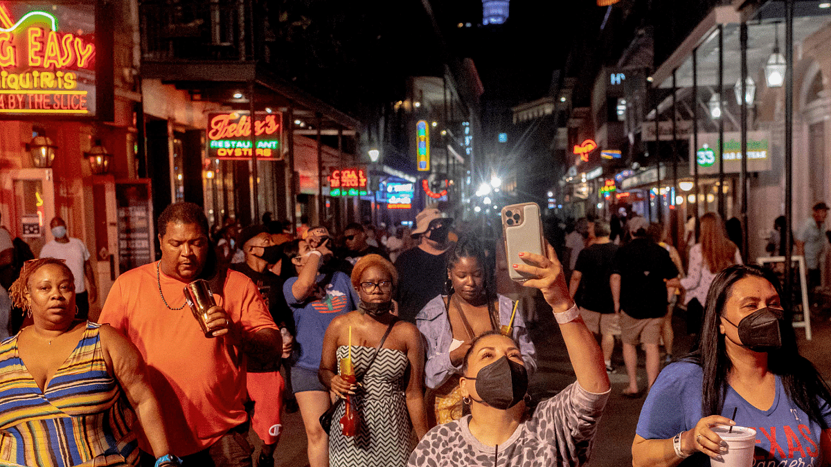 Partygoers on Bourbon Street in New Orleans, on August 13, 2021 as Louisiana Governor John Bel Edwards ordered an indoor mask mandate amid Covid-19 surge. Credit: AFP Photo