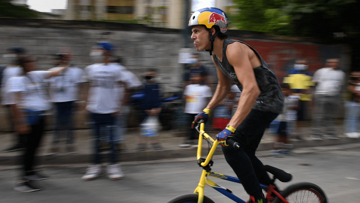 Venezuelan BMX freestyle racer Daniel Dhers, who won the silver medal in the Tokyo 2020 Olympic Games, rides his bike during an exhibition at the Cota 905 neighborhood, in Caracas. Credit: AFP Photo