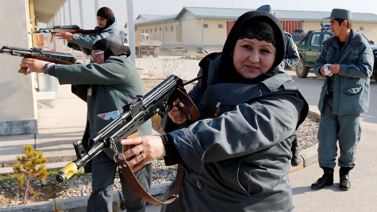 Female Afghan National Police (ANP) officers aim their weapons during a drill at a training centre near the German Bundeswehr army camp Marmal in Mazar-e-Sharif, northern Afghanistan December 11, 2012. Credit: Reuters Photo
