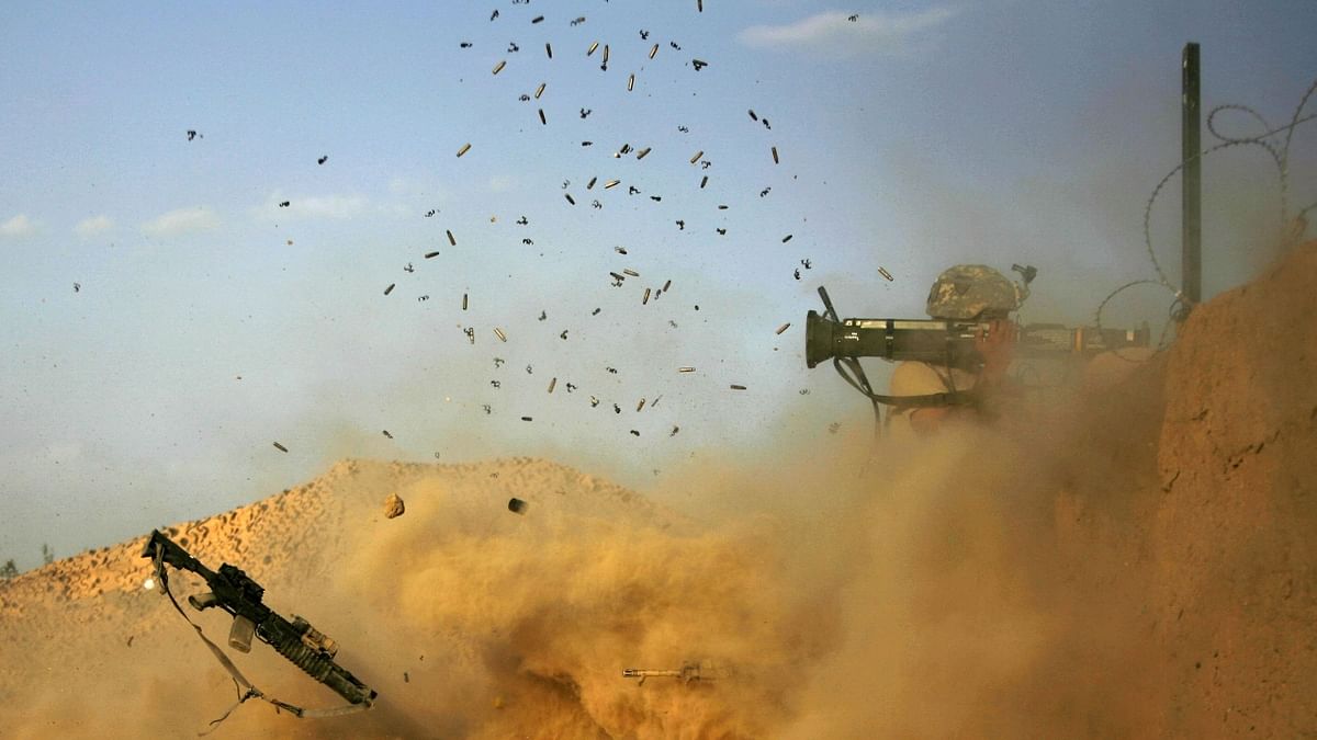 US army soldier with the 101st Airborne Division Alpha Battery 1-320th fires an AT-4 as Combat Outpost Nolen on the outskirts of the village of Jellawar in the Arghandab Valley came under Taliban attack on September 11, 2010. Credit: AFP Photo