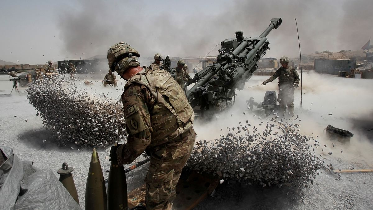 US Army soldiers from the 2nd Platoon, B battery 2-8 field artillery, fire a howitzer artillery piece at Seprwan Ghar forward fire base in Panjwai district, Kandahar province southern Afghanistan. Credit: Reuters Photo