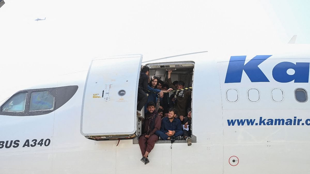 A packed aircraft filled by hundreds of people as they wait leave the Kabul airport. Credit: AFP Photo