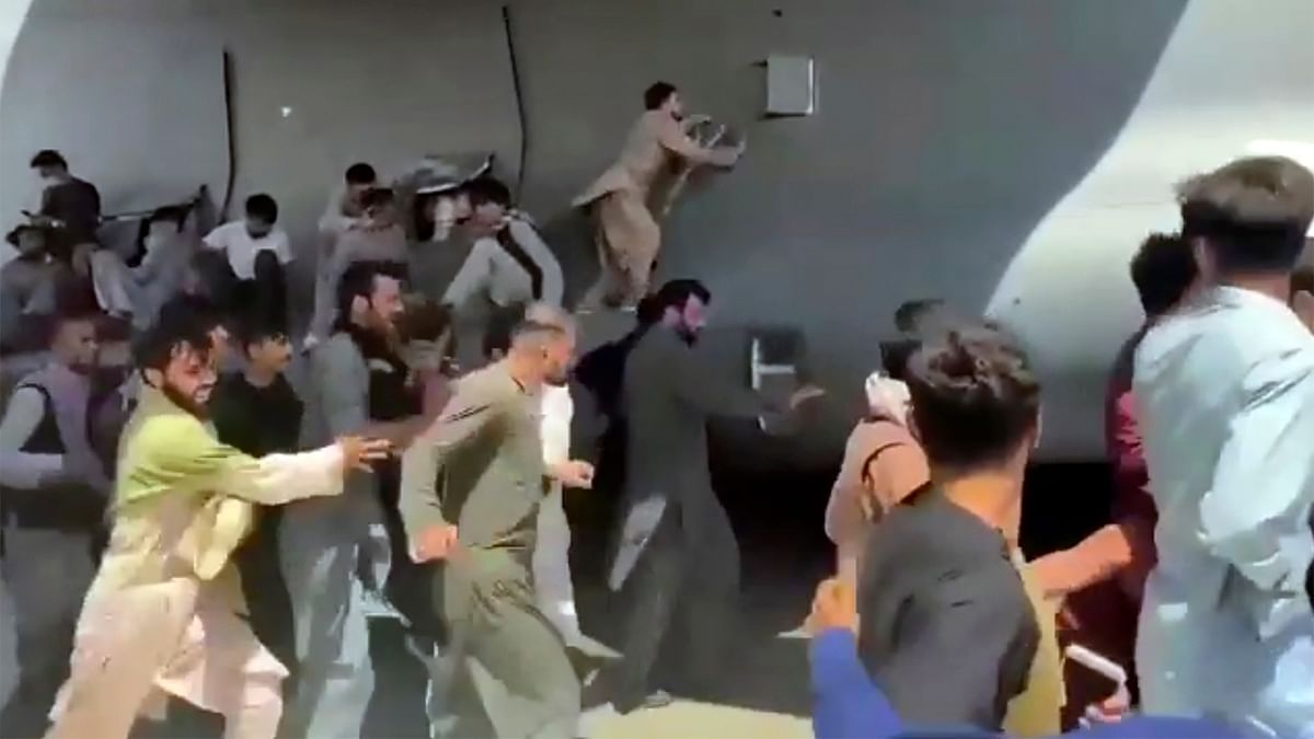 In Pics | Chaos at Kabul airport as desperate Afghans flee amid Taliban takeover