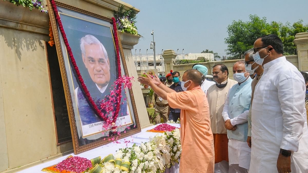 Uttar Pradesh Chief Minister Yogi Aditiyanath offers floral tribute to former prime minister Atal Bihari Vajpayee on his death anniversary at Lok Bhawan in Lucknow. Credit: PTI Photo