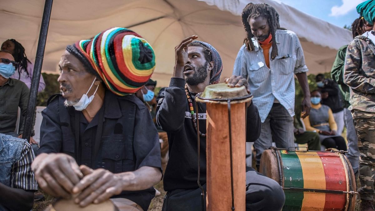 Adherents of the rastafari sect, known as the Rastafari Society of Kenya, participate in a meditative 'nyabinghi' chant (a drumming style used in religious practices) as they prepare to plant tree seedlings in commemoration of the birthday of Jamaican black empowerment activist, Marcus Garvey, at Oloolua Forest in Ngong. Credit: AFP Photo