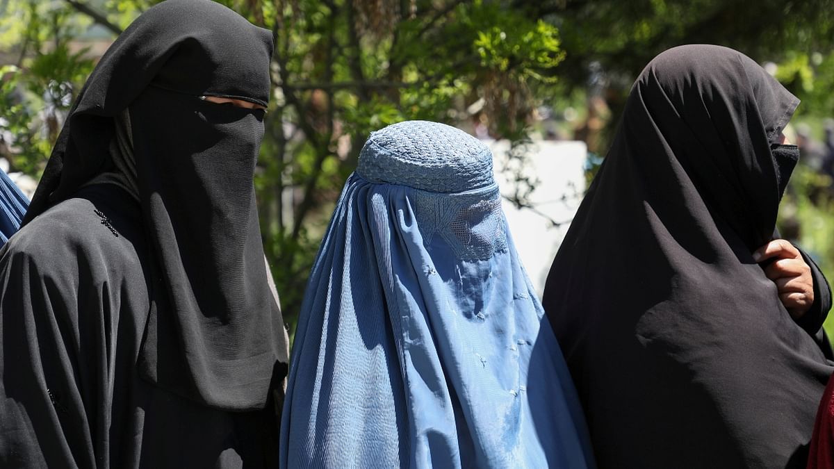 Women in Afghanistan were forced to wear the burqa in public and are only allowed to step out with a male relative.  Credit: Reuters Photo