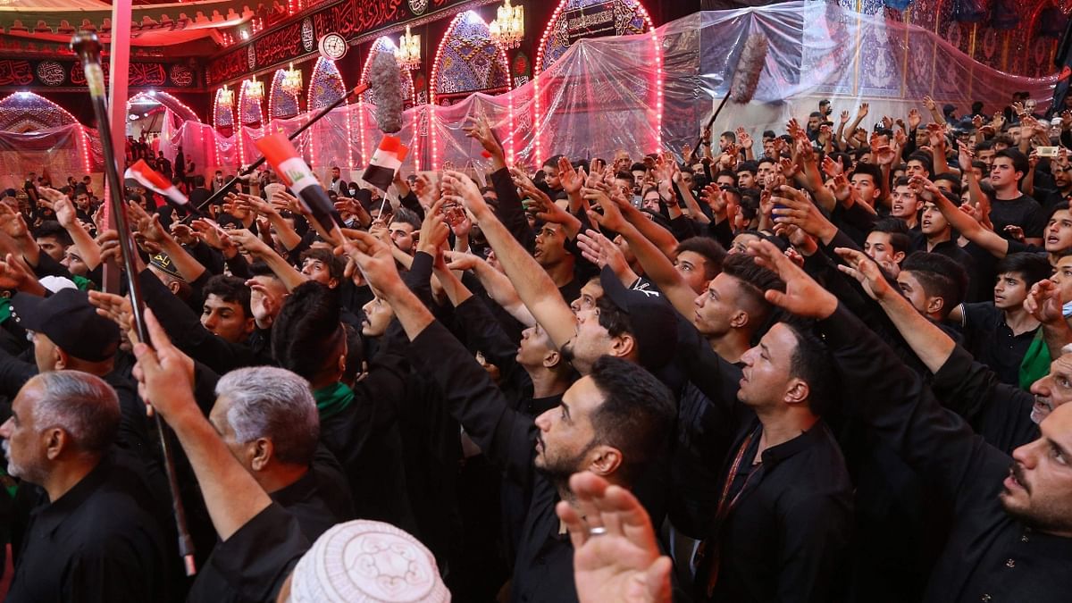 Iraqi Shia Muslims take part in a religious procession during the ten-day mourning period leading up to Ashura, in the central holy city of Karbala. Credit: AFP Photo