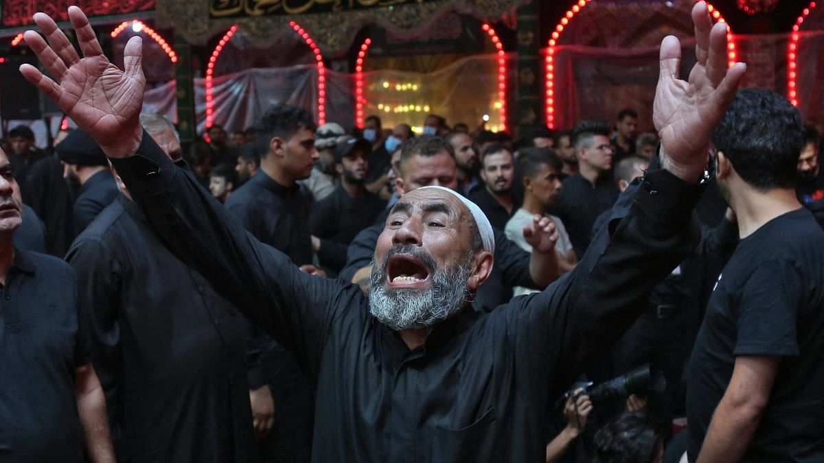 Iraqi Shiite Muslims take part in a mourning procession during the month of Muharram. Credit: AFP Photo