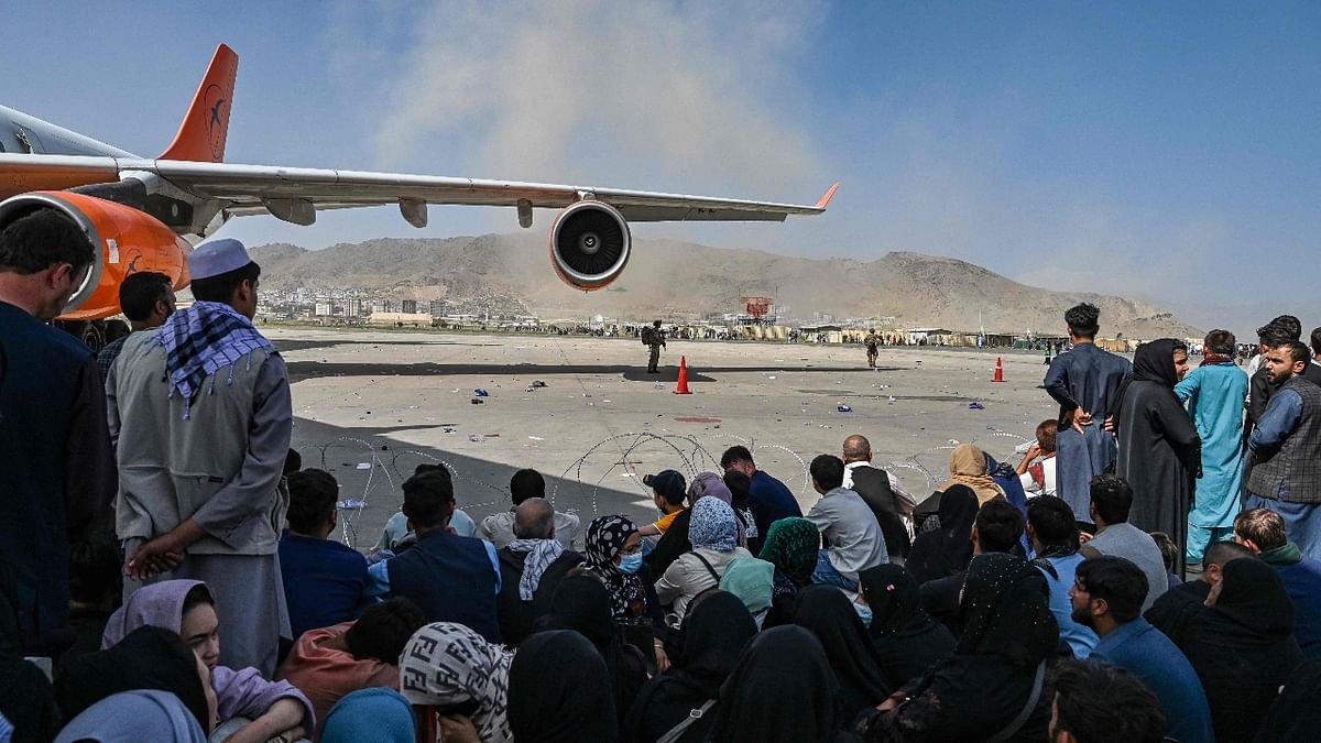 Afghan passengers waiting to leave the Kabul airport. Credit: AFP Photo