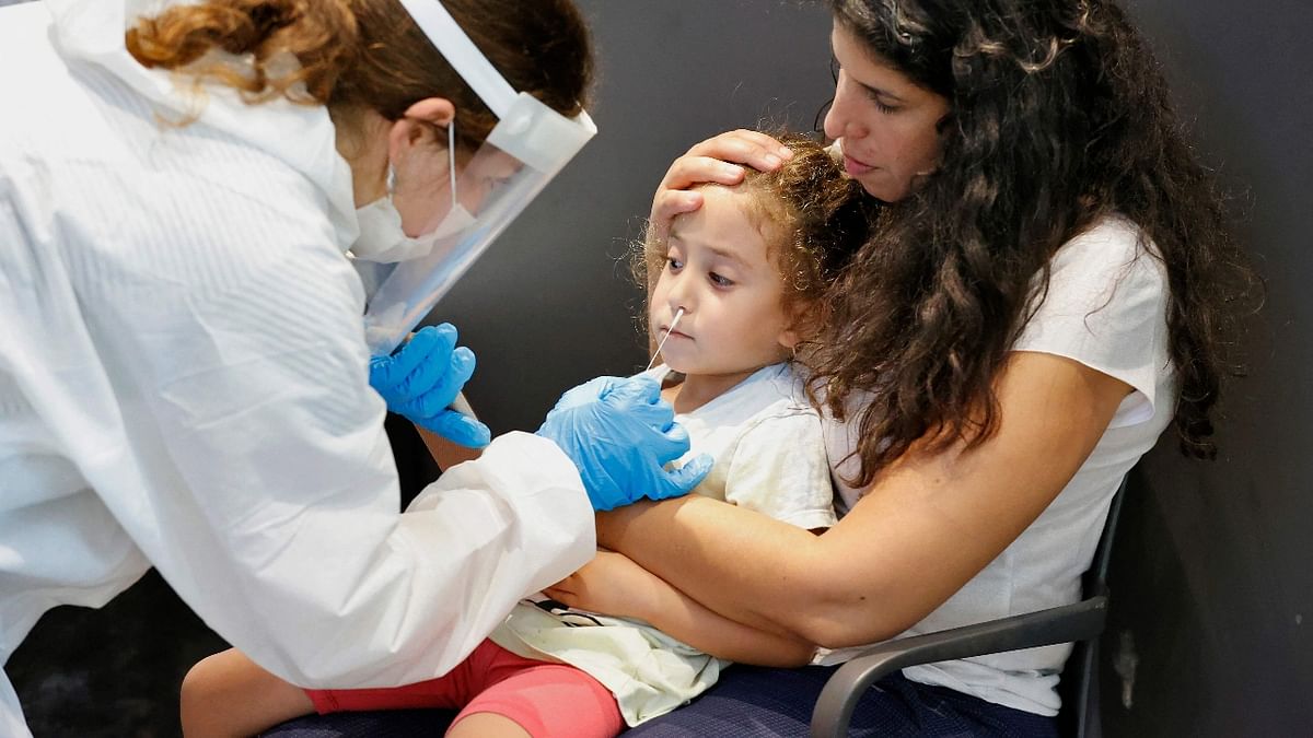 Children as young as three are required to undergo the Covid-19 test to get a green pass that will allow them to enter schools, swimming pools, hotels and amusement parks. Credit: AFP Photo