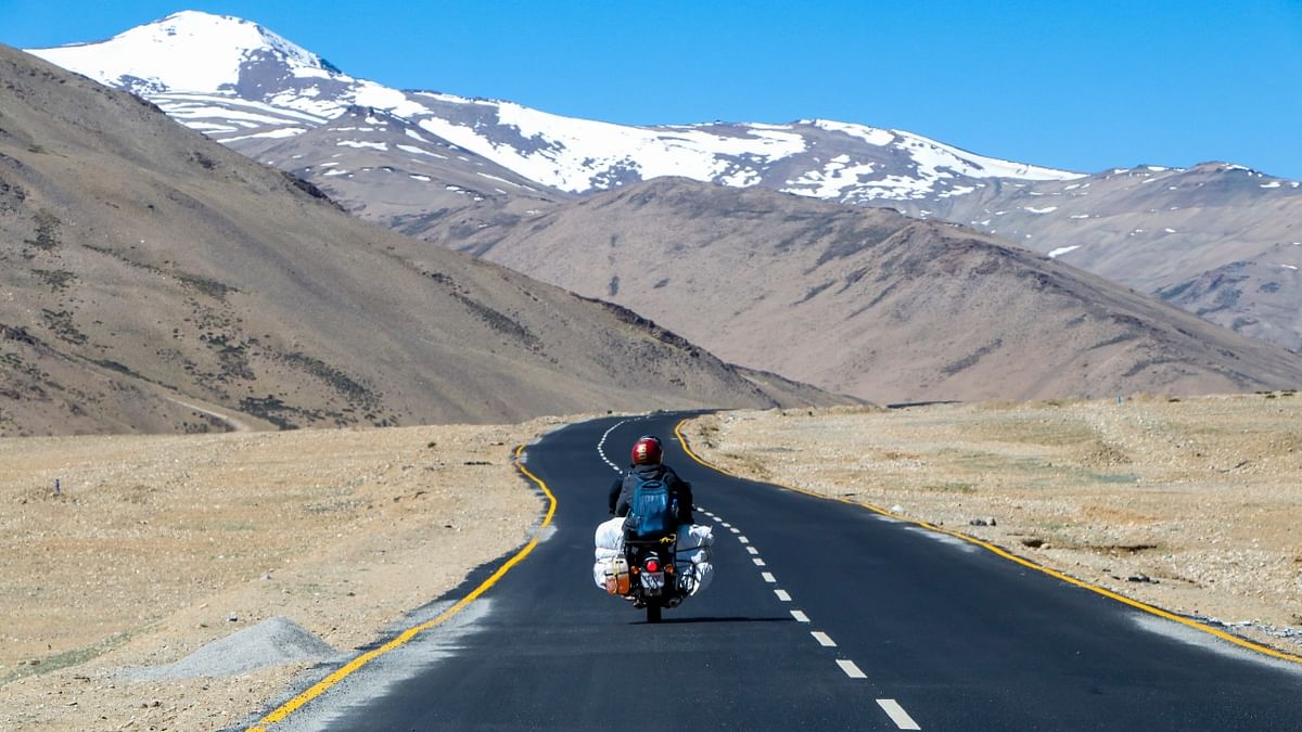Ladakh: Biker’s paradise, Ladakh, is also a photographers dream place. The picturesque snow-clad mountains and the clean environment make for a beautiful subject of photography. Credit: Unsplash/Sandeep Kumar Yadav