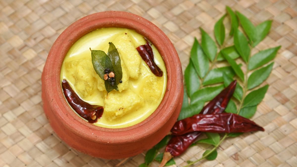 Pulisseri: This is a thick, sour yellow-coloured curry, made with sour curd and cucumber. Credit: Getty Images