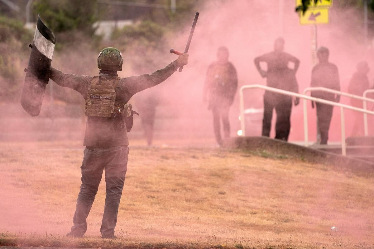 A far-right activist taunts counter-protesters as far-right Proud Boys and other activists clash with counter-protesters during rival rallies in Portland, Oregon, US. Credit: Reuters Photo