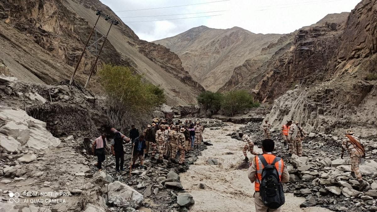 ITBP personnel from North West Frontier, Leh (special response & rescue team) assisted Ladakh Police in rescuing 17 villagers who were missing following a cloudburst in Rumbok village in Ladakh. Credit: AFP Photo
