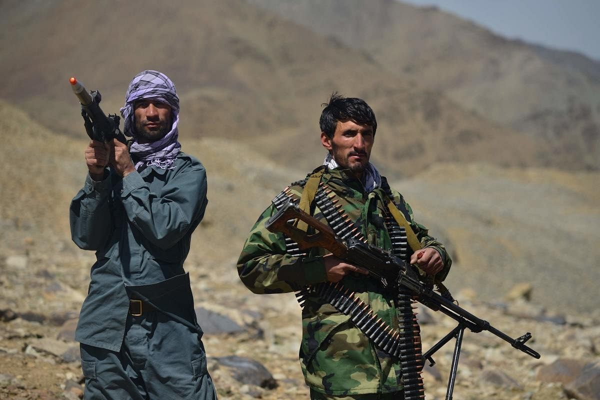 - Afghan resistance movement and anti-Taliban uprising forces personnel stand guard at an outpost in Kotal-e Anjuman of Paryan district in Panjshir province. Credit: AFP Photo