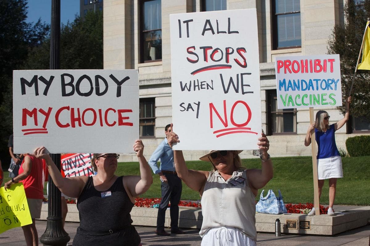 Anti-vaccine mandate protesters demonstrate outside of the Ohio Statehouse in Columbus, to support the Vaccine Choice and Anti-Discrimination Act, a bill that would prohibit mandatory vaccinations, and vaccination status disclosures. Credit: AFP Photo