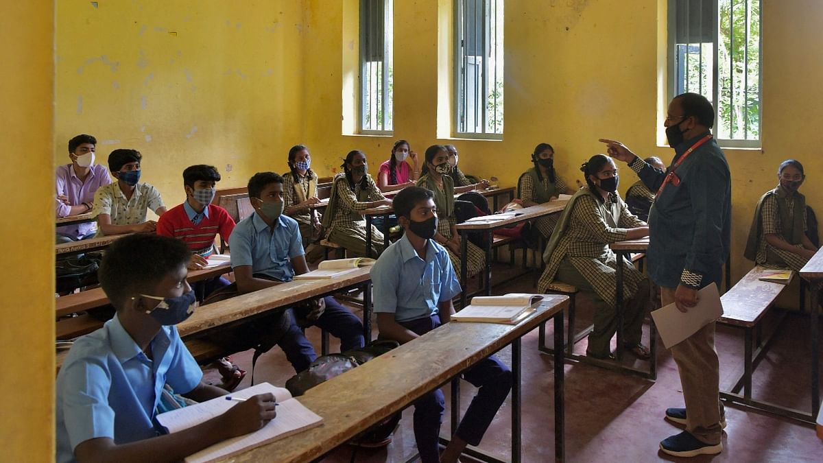 Schools and Pre-University (PU) colleges in Bengaluru and in other districts of Karnataka where the Covid test positivity rate is less than two per cent reopened for students of classes 9-12 on August 23 after a gap of five months. Credit: AFP Photo