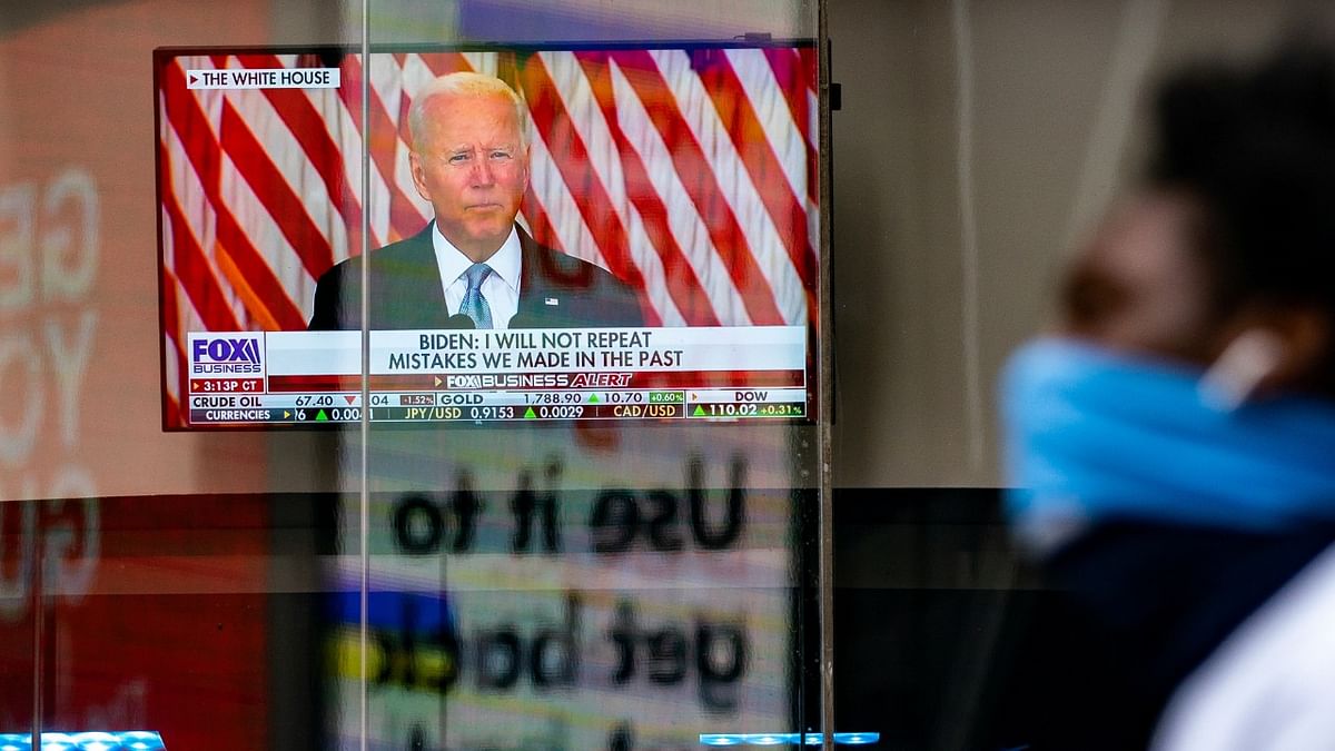 A screen displays the US President Joe Biden's remarks on the crisis in Afghanistan at the Nasdaq MarketSite in Times Square in New York City. Credit: Reuters Photo