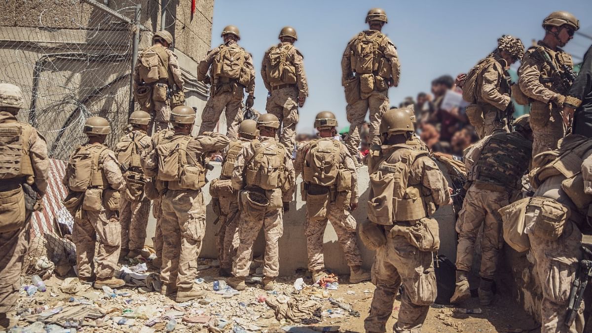 US Marines with Special Purpose Marine Air-Ground Task Force - Crisis Response - Central Command, assist with security at an Evacuation Control Checkpoint (ECC) during an evacuation at Hamid Karzai International Airport, Kabul. Credit: USMC Photo/Staff Sgt. Victor Mancilla