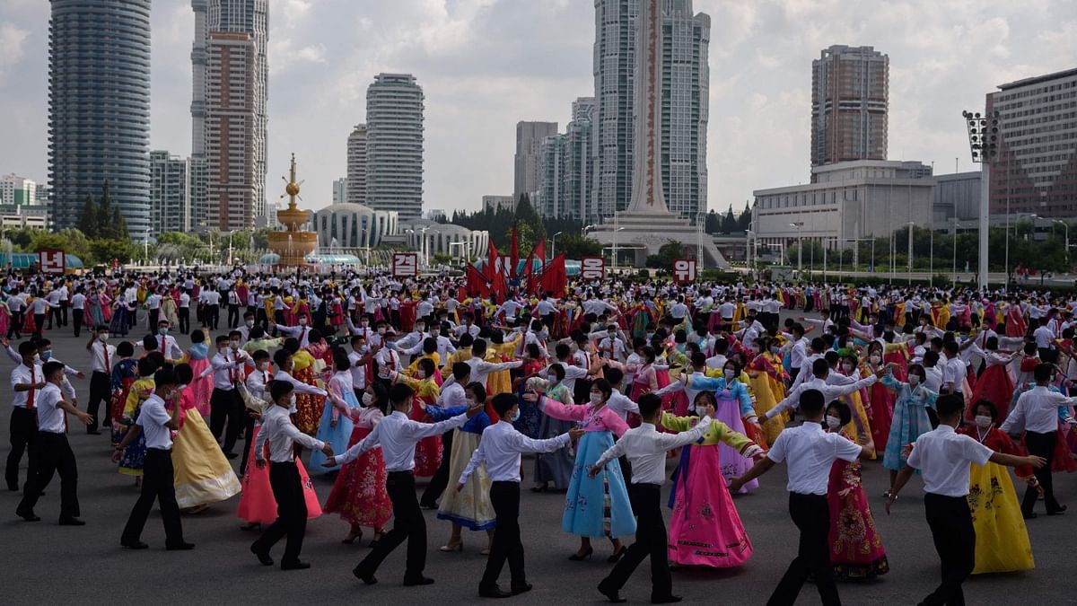 Students and other youth take part in a dance event celebrating the country's 'Youth Day' at the plaza of the April 25 House of Culture in front of the building of the showcase Ryomyong street in Pyongyang. Credit: AFP Photo