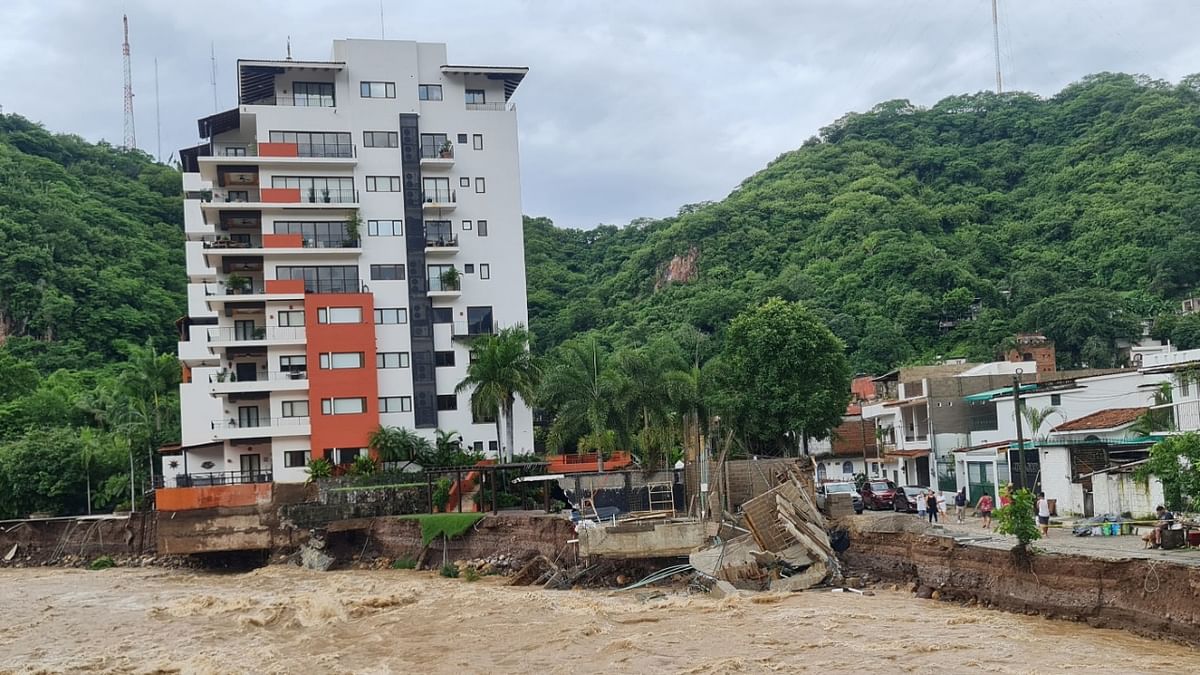 A view shows swollen Cuale river waters after that Hurricane Nora pounds Mexico coast with heavy rains and strong winds in Puerto Vallarta, in Jalisco state, Mexico. Credit: Reuters photo