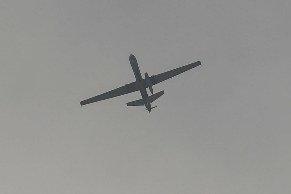 A US drone flies over the airport in Kabul on August 31, 2021 - The US military announced it has completed its withdrawal from Afghanistan. Credit: AFP Photo