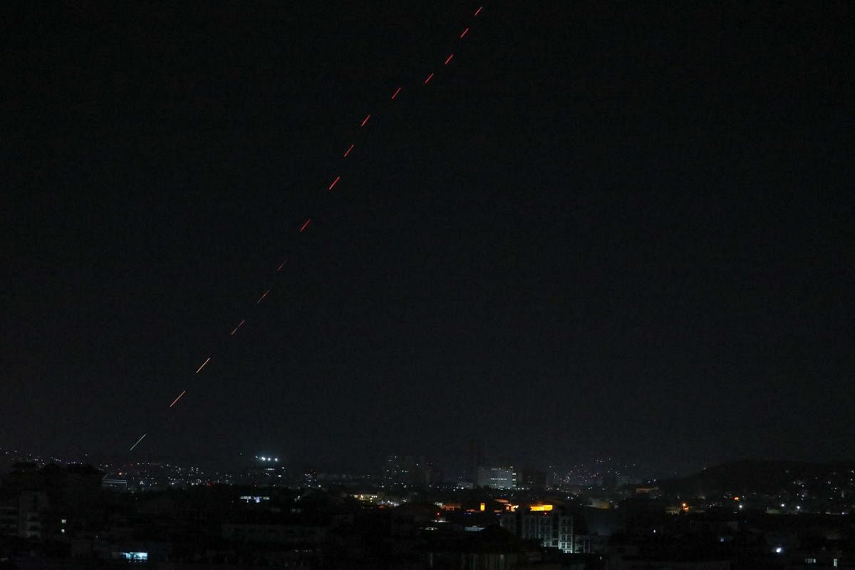 Celebratory gunfire lights up part of the night sky after the last US aircraft took off from the airport in Kabul early on August 31, 2021. Credit: AFP Photo