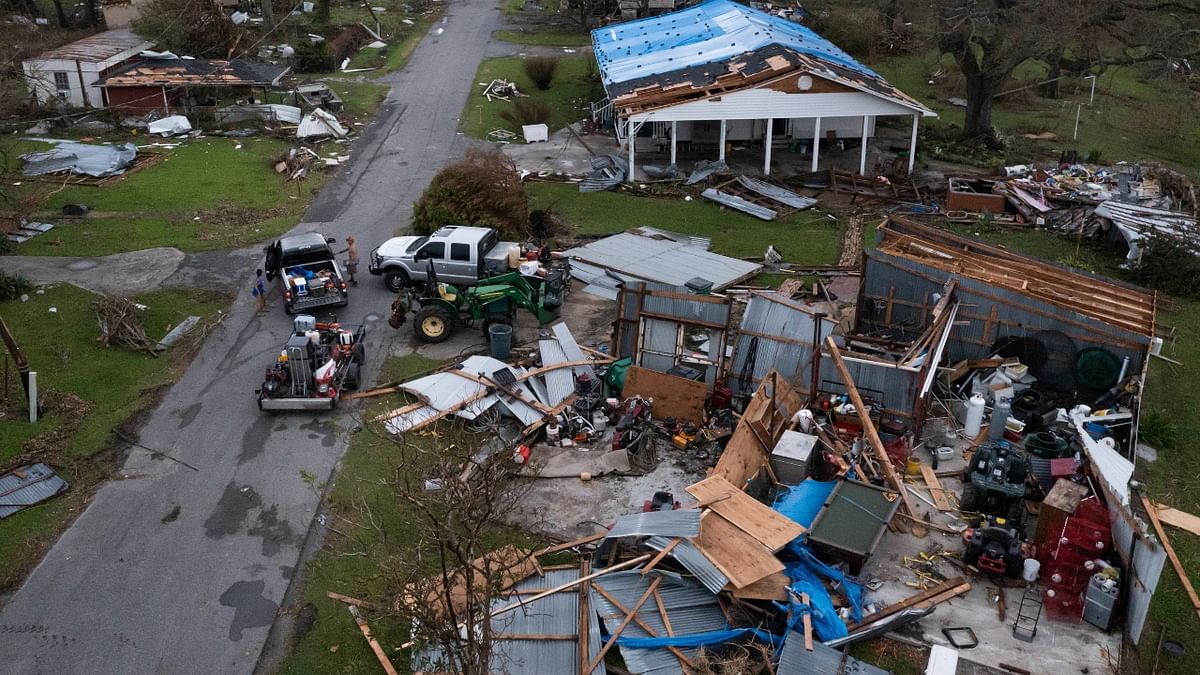 A couple collect belongings from their damaged property in the aftermath of Hurricane Ida in Golden Meadow, Louisiana, US. Credit: Reuters Photo